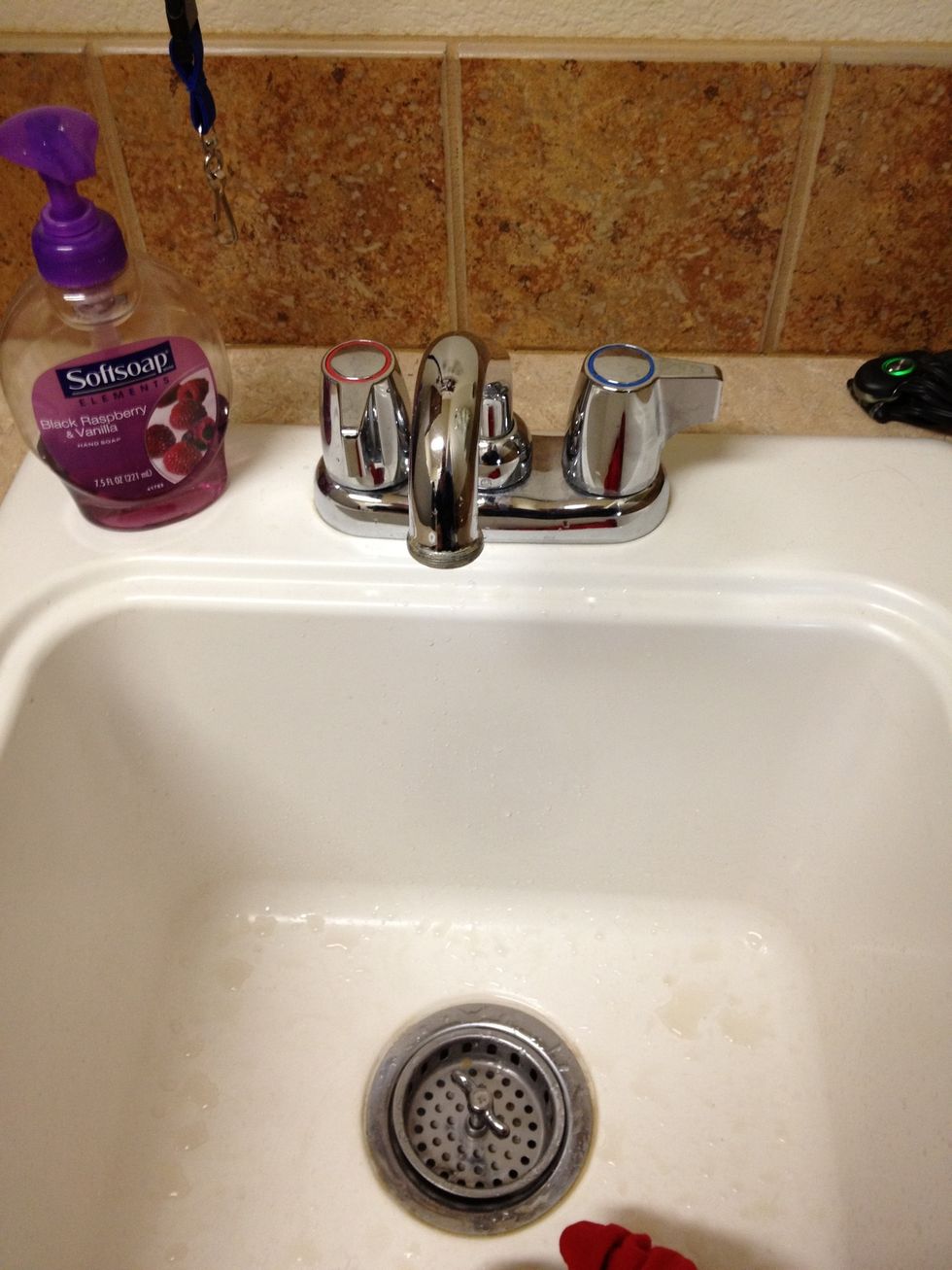 Open a hot water faucet inside the house. This relieves the vacuum on the water heater. Locate a faucet that has 2 handles (usually a bathroom sink), faucets with single handles do not work.