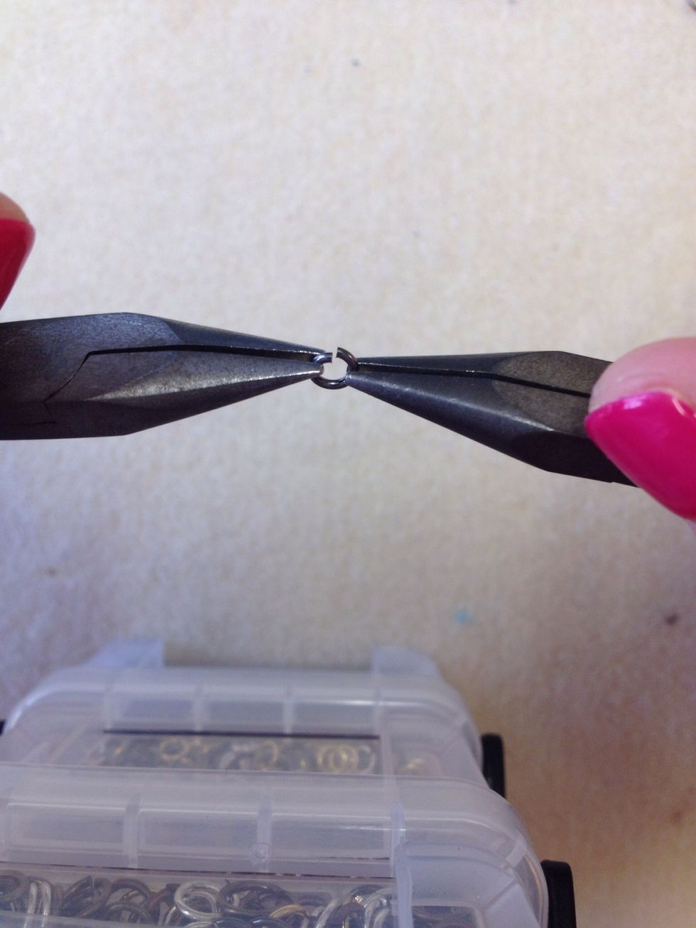 Open a jump ring to attach the chain to the kilt pin rings