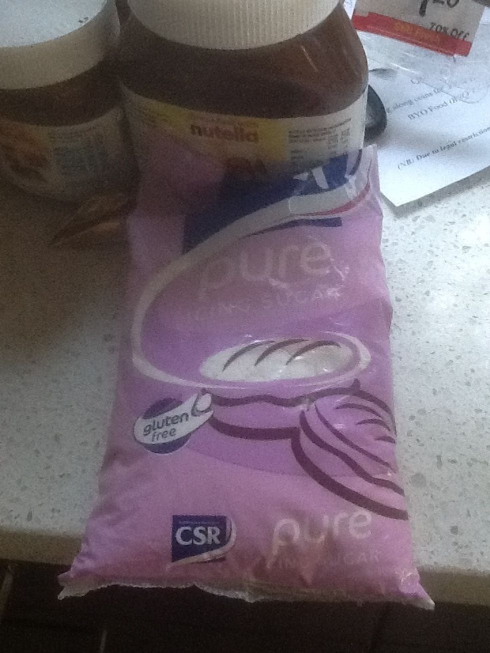 Open a pack of icing suger