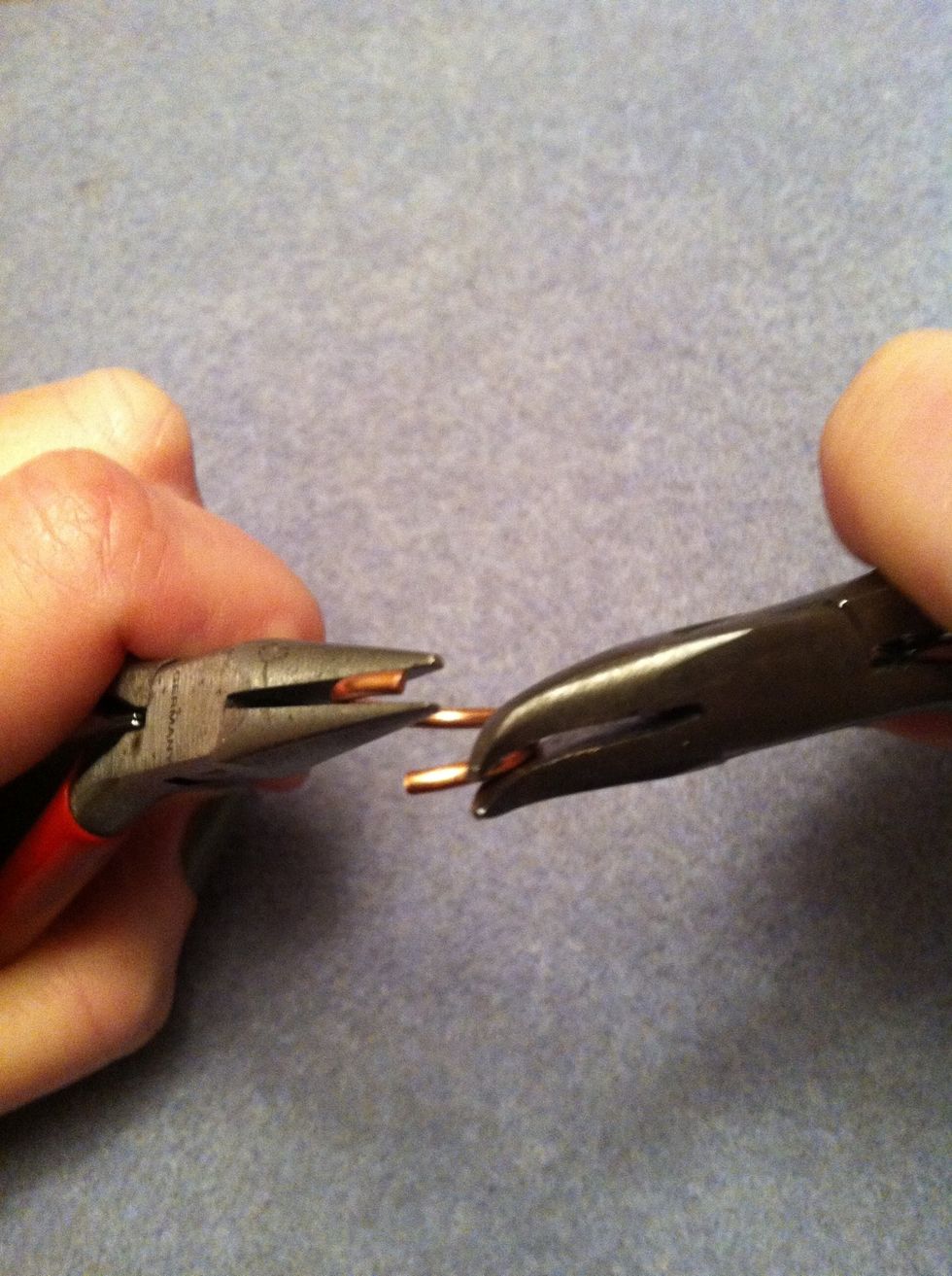 Open a second ring. Note how the ring swings open to the side maintaining the round shape  of the ring. Add the first closed ring and then close this ring.