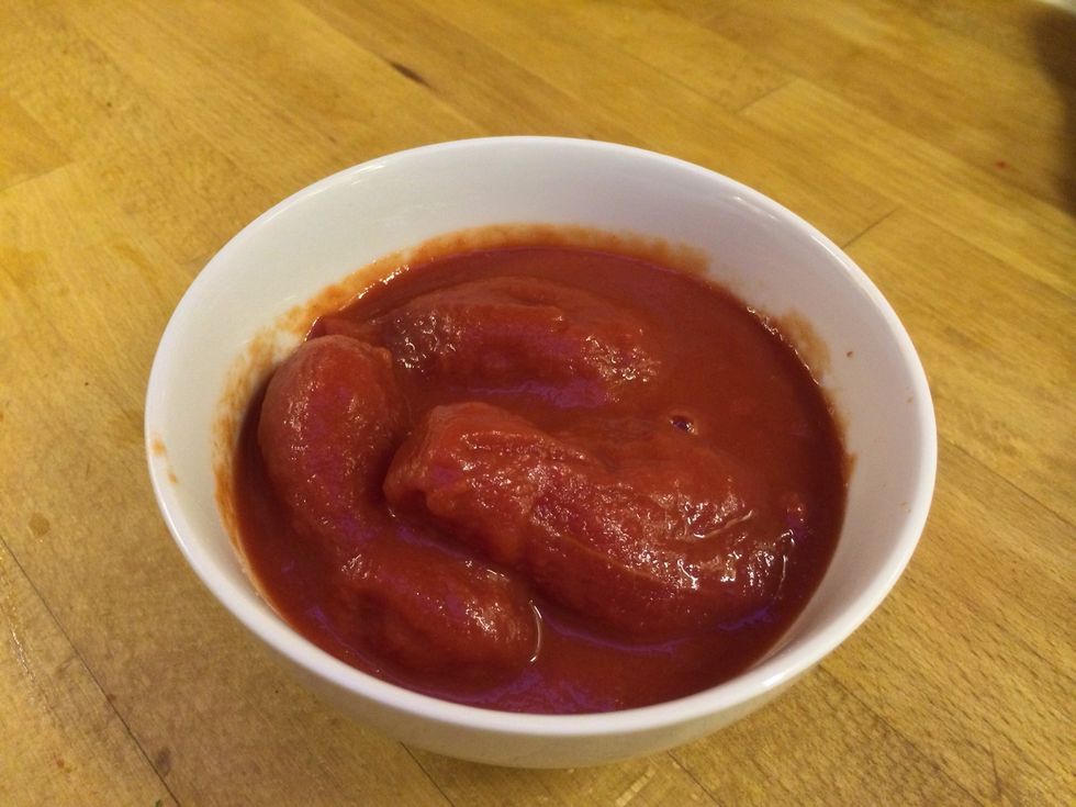 Open a tin of tomatoes.