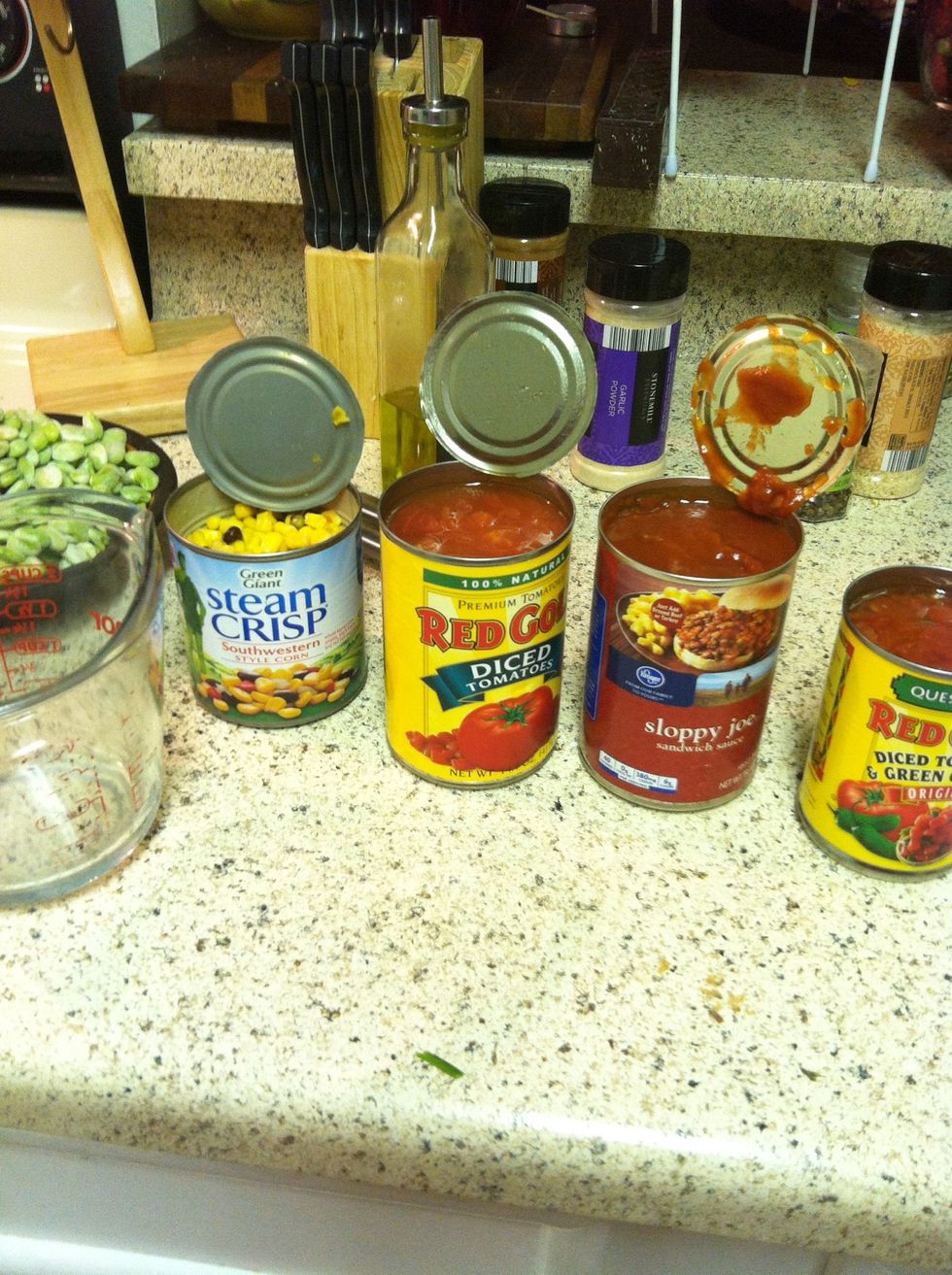 Open all your cans. Condensed tomato soup not shown. Also get a straining device and a container to catch the liquid.