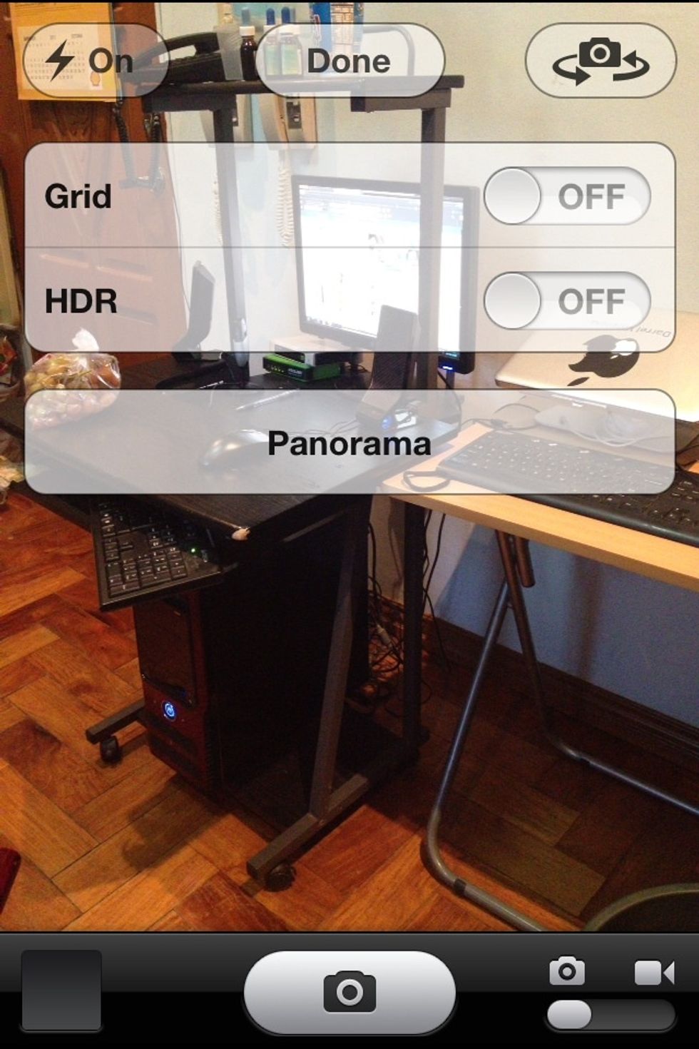 Open Camera App. Tap Option at the top and choose Panorama. Click Done