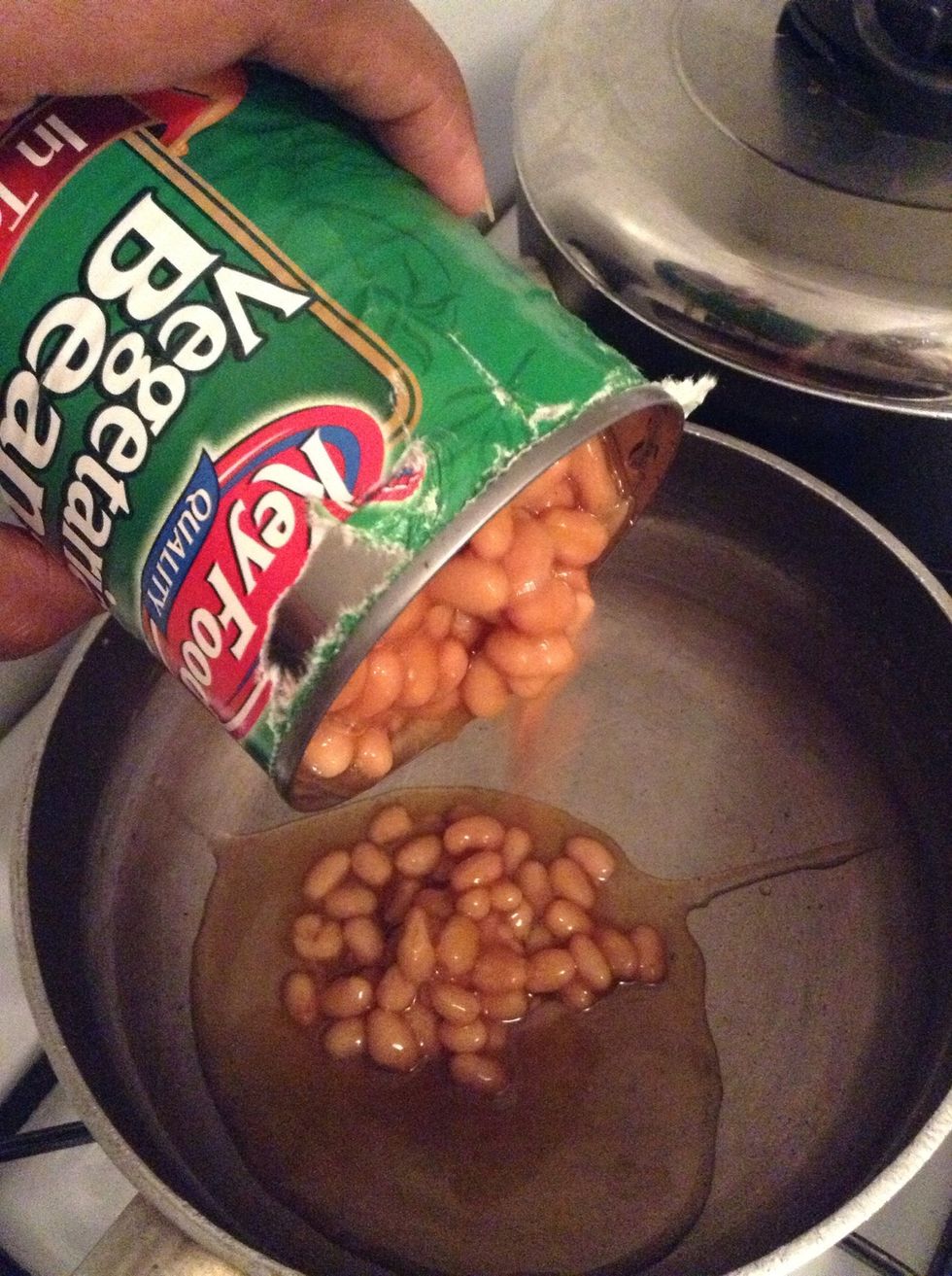 Open can and put into a small pot