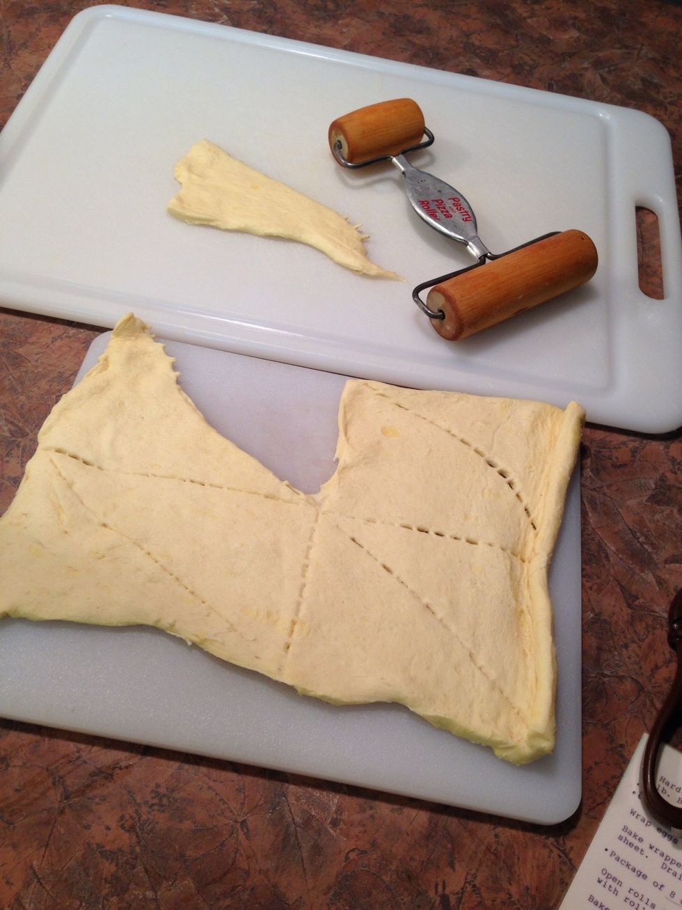 Open Crescent rolls and separate into 8 triangles.