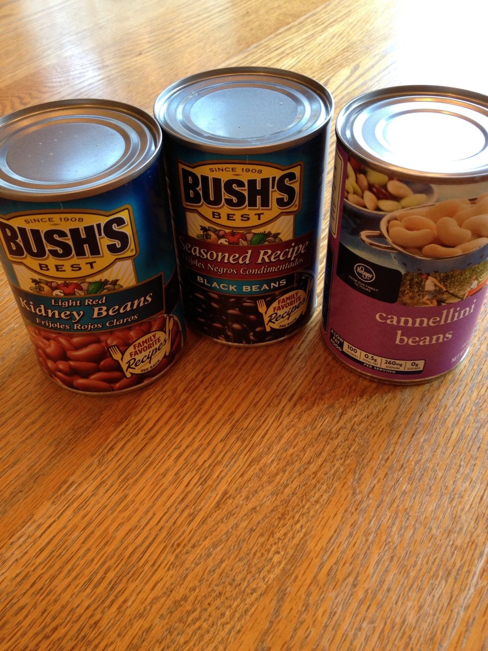 Open each can of beans. Rinse and drain separately.