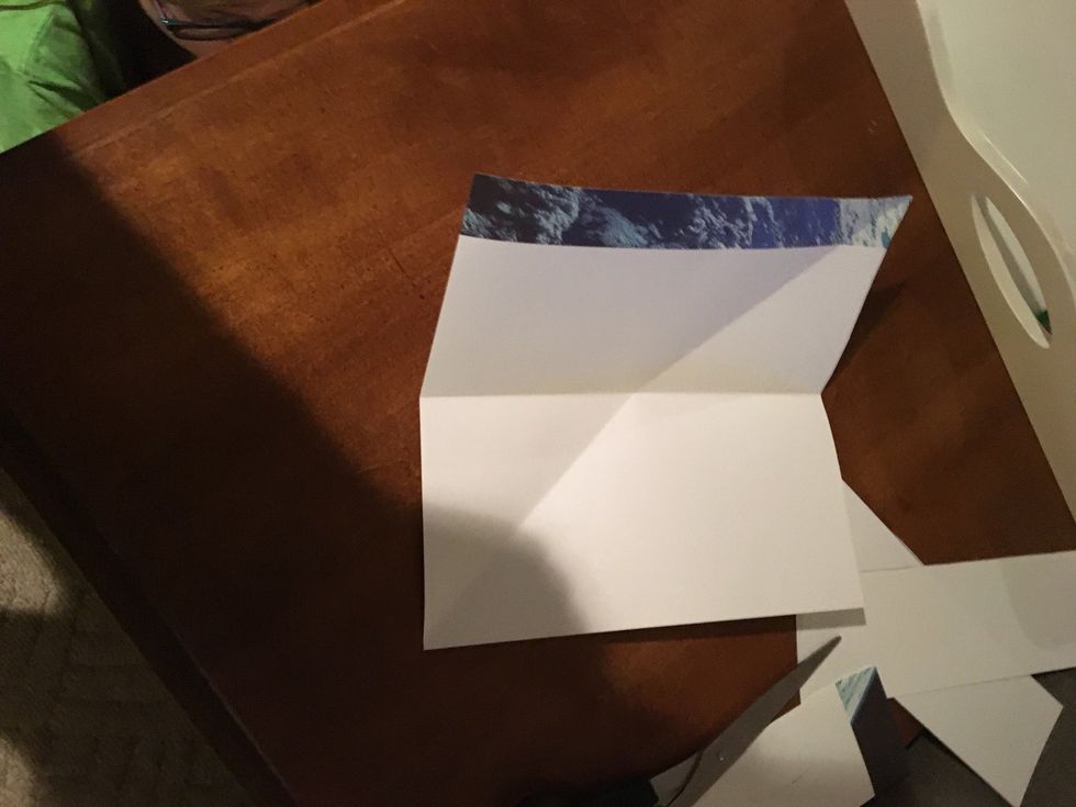 Open it up and fold in half then open it up again