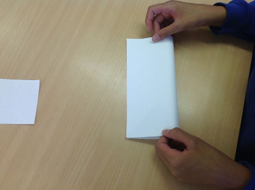 Open it up and fold it in half.