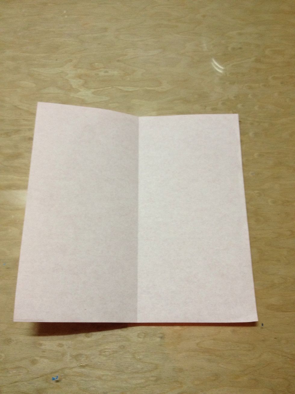 Open. Make sure that the coloured surface is facing down. The central line is a guide line for the next step.