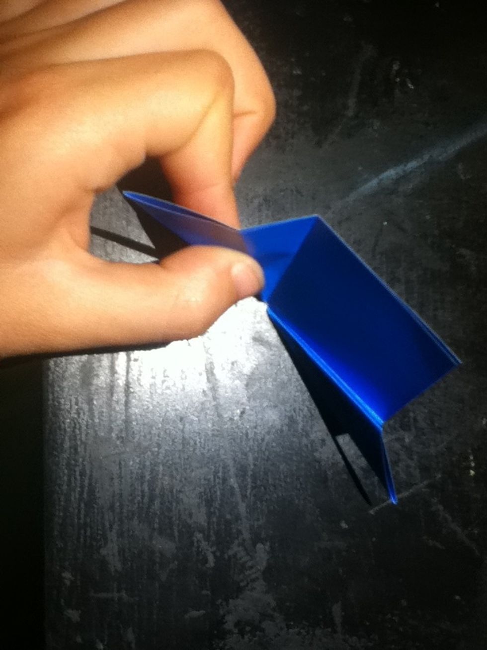 Open out one of the sides, and notice the double layers of the part I am holding.