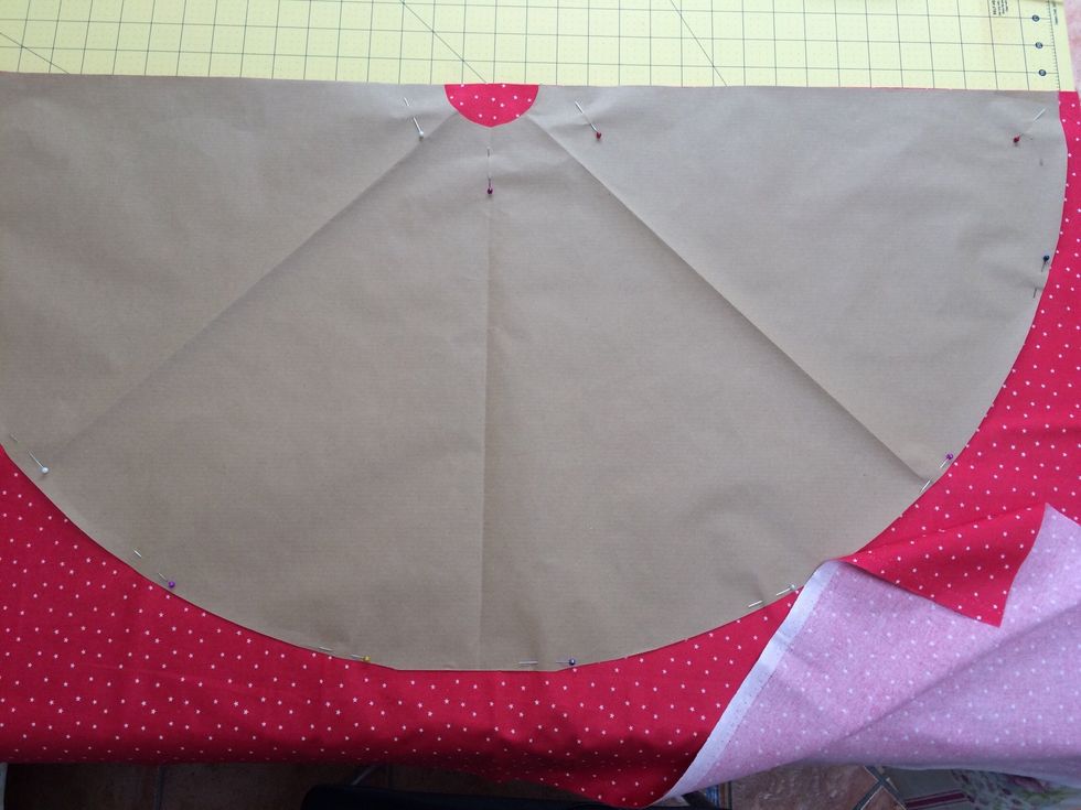 Open paper out and place straight edge on fold of main fabric. Repeat on batting