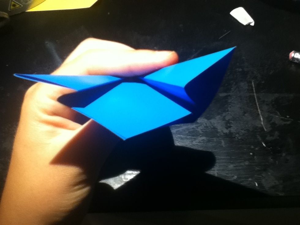 Open that part into a pocket, and flatten it down on the crease marks already established.