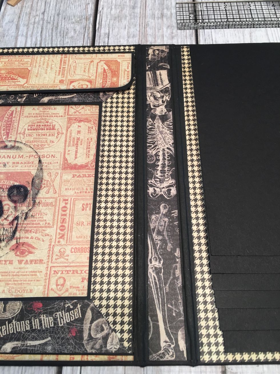 Open the album up an attach patterned paper to each inside spine section.  Cut 2 each 10 1/2" tall x 7/8" wide for the 1" sections and cut 1 each 10 1/2" tall x 2 3/8" wide for the 2 1/2" section.