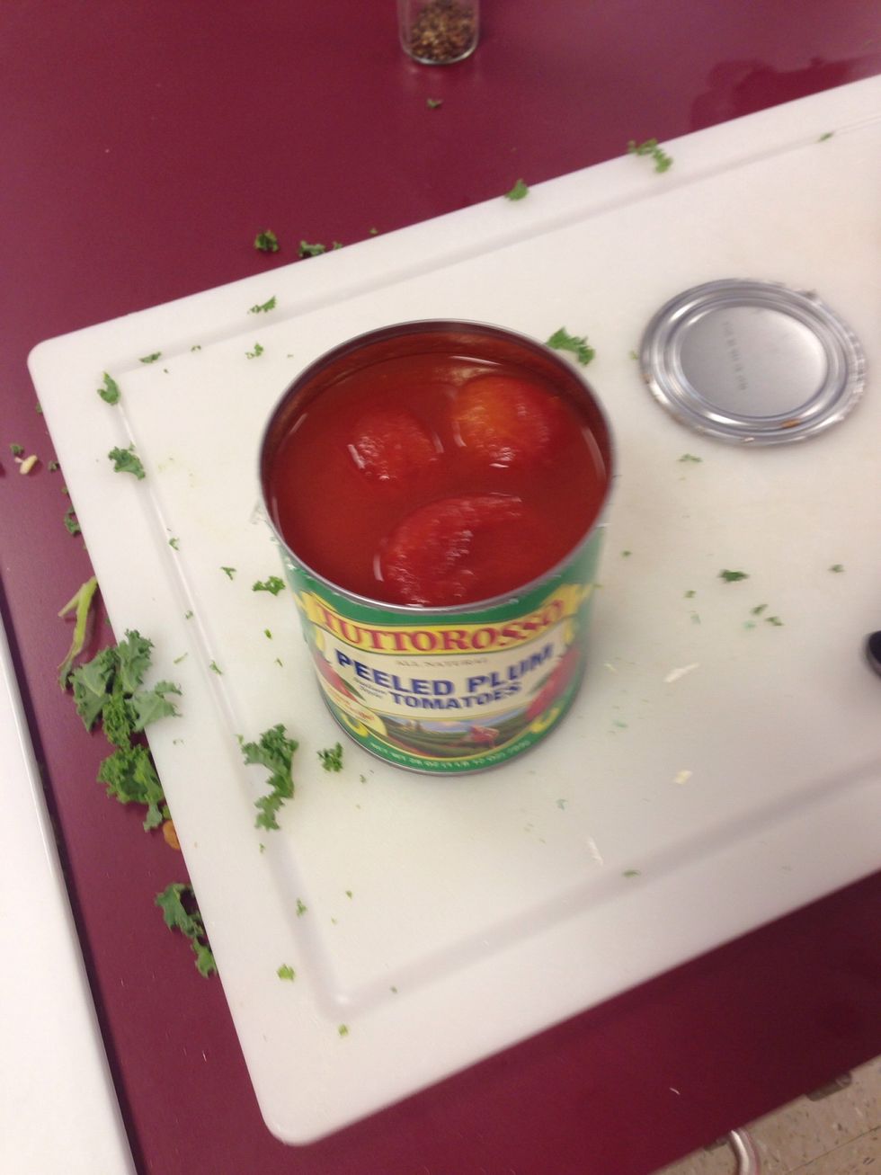 Open the can of peeled plum tomatoes