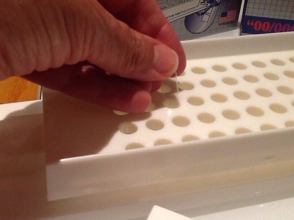 Open the capsule, insert the longer end. Set the shorter cap aside.