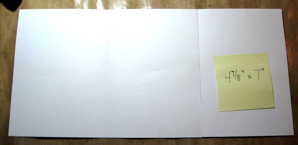 Open the card bases and lay them side by side so that the narrower card is on the right. You are going to overlap the left hand panel of that card onto the right hand panel of the card on the left.