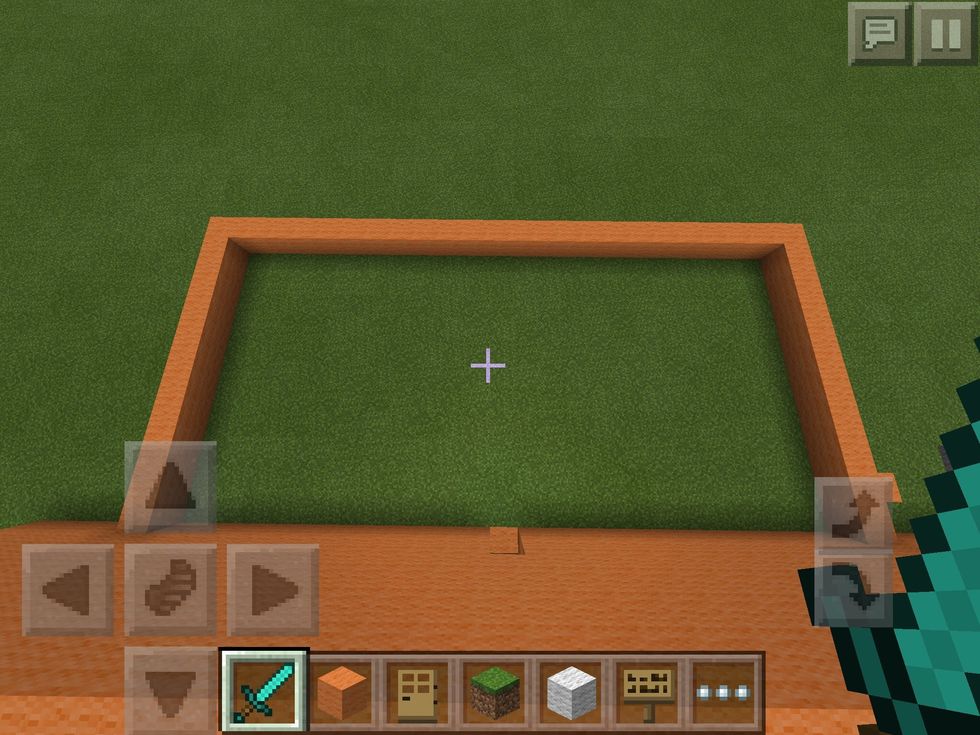 Open the door and do a 12x12 room. If that is to big or small for your liking, add or take away blocks. Add walls as high as your shop.