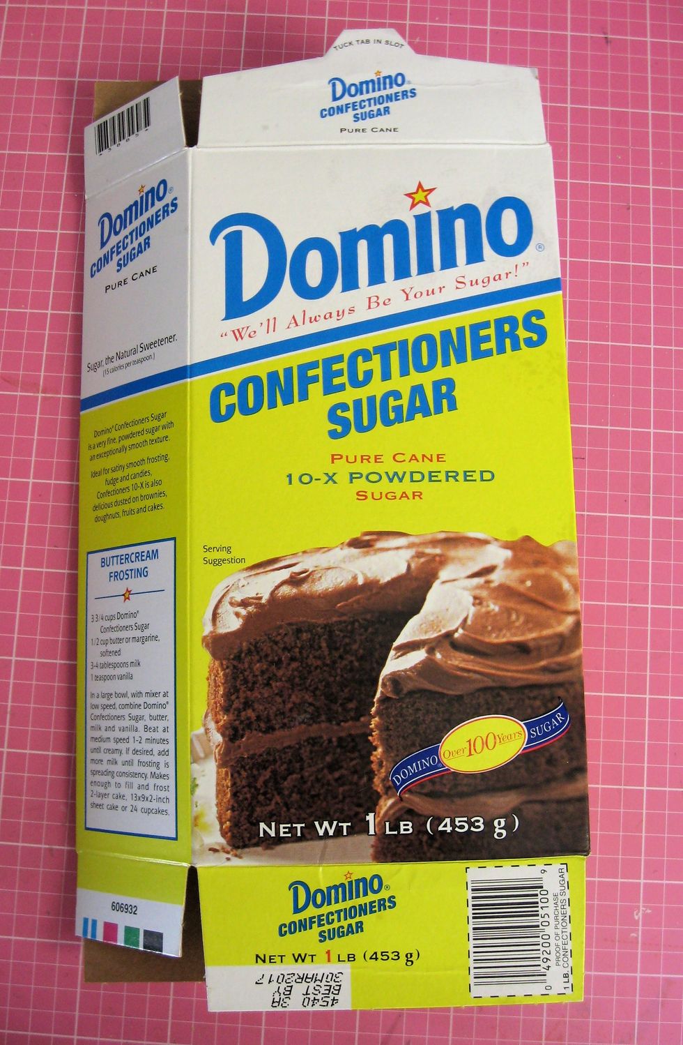Open the end flaps on a 1# box of confectioner's sugar and flatten.