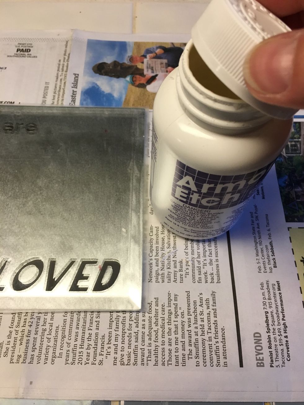 Open the etching cream over paper to catch any loose bits.