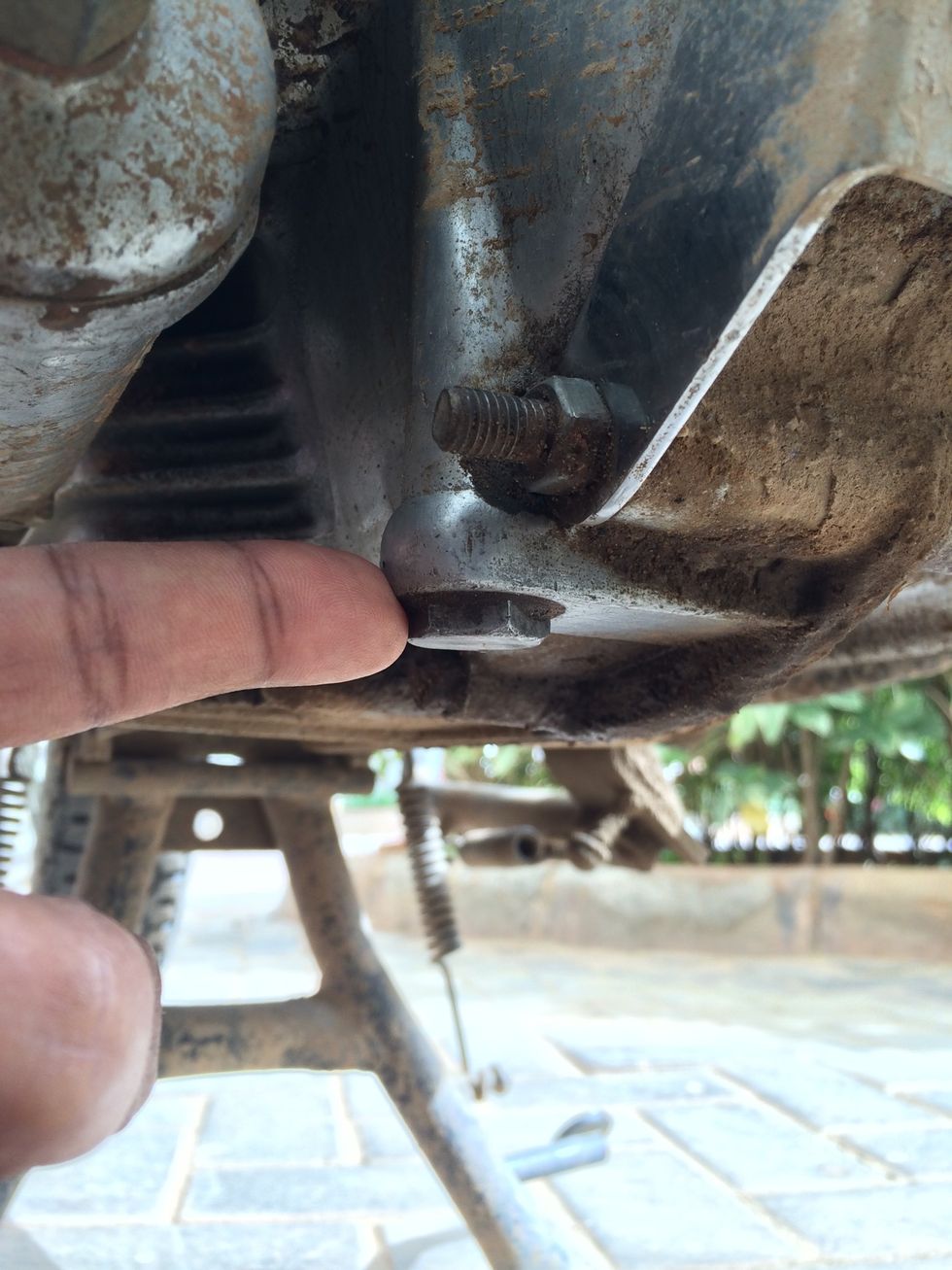 Open the first strainer bolt from the front of the engine. (The strainer bolt closer to the oil pump and feeder system).