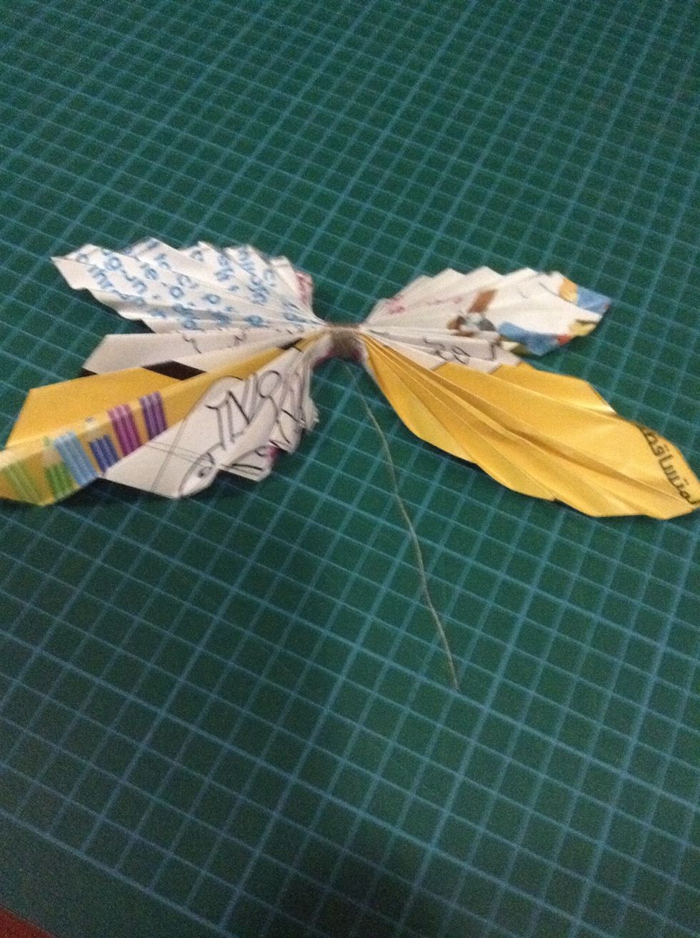 Open the folded pages and now you've got the shape of the butterfly .. For me ,, I'd like to spray my butterfly with my room's colour ! ,, this way .... ---->