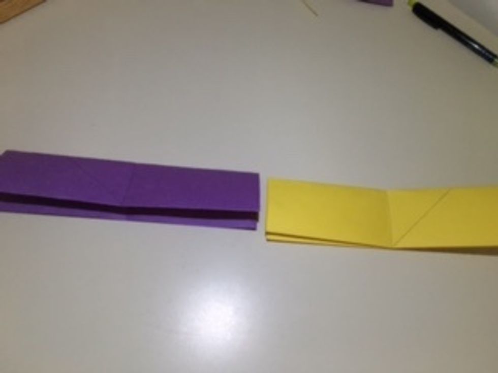 Open the "hamburger" fold so you have step 7, but now it has the vertical crease down the middle. Both are mirror images. I traced the creases, as well as the triangles' creases. (You don't have to).
