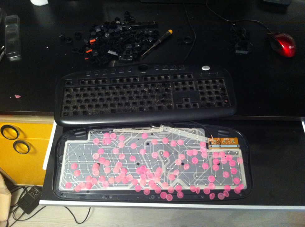 Open the keyboard but be carefull .. Don't lose these pink plastic buttons