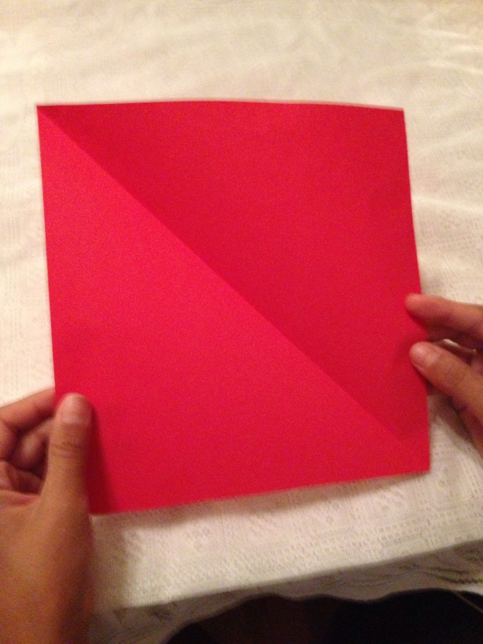 Open the paper and you should have a square paper.