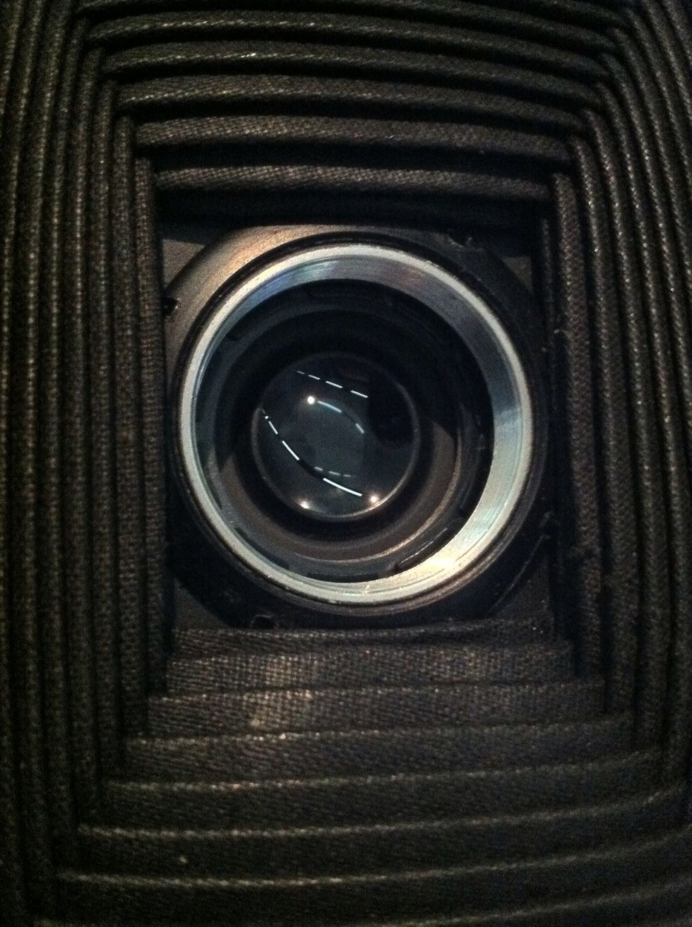 Open the shutter (open the camera to achieve this. As wide as the aperture goes. Polish the under side of the inner glass