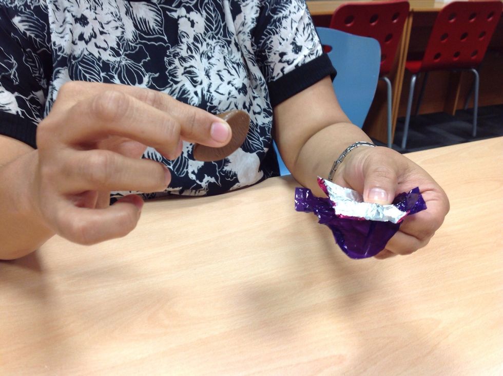 Open the wrapper and remove the chocolate