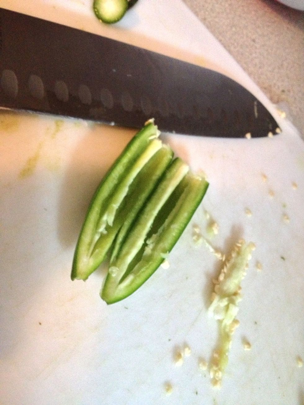 Open them in half and scrap the seeds and veins with your knife, this will give the guac a lighter spice but keeping the pepper flavor.  DO NOT TOUCH YOUR NOSE OR EYES AFTER HANDLING THE PEPPERS!!!