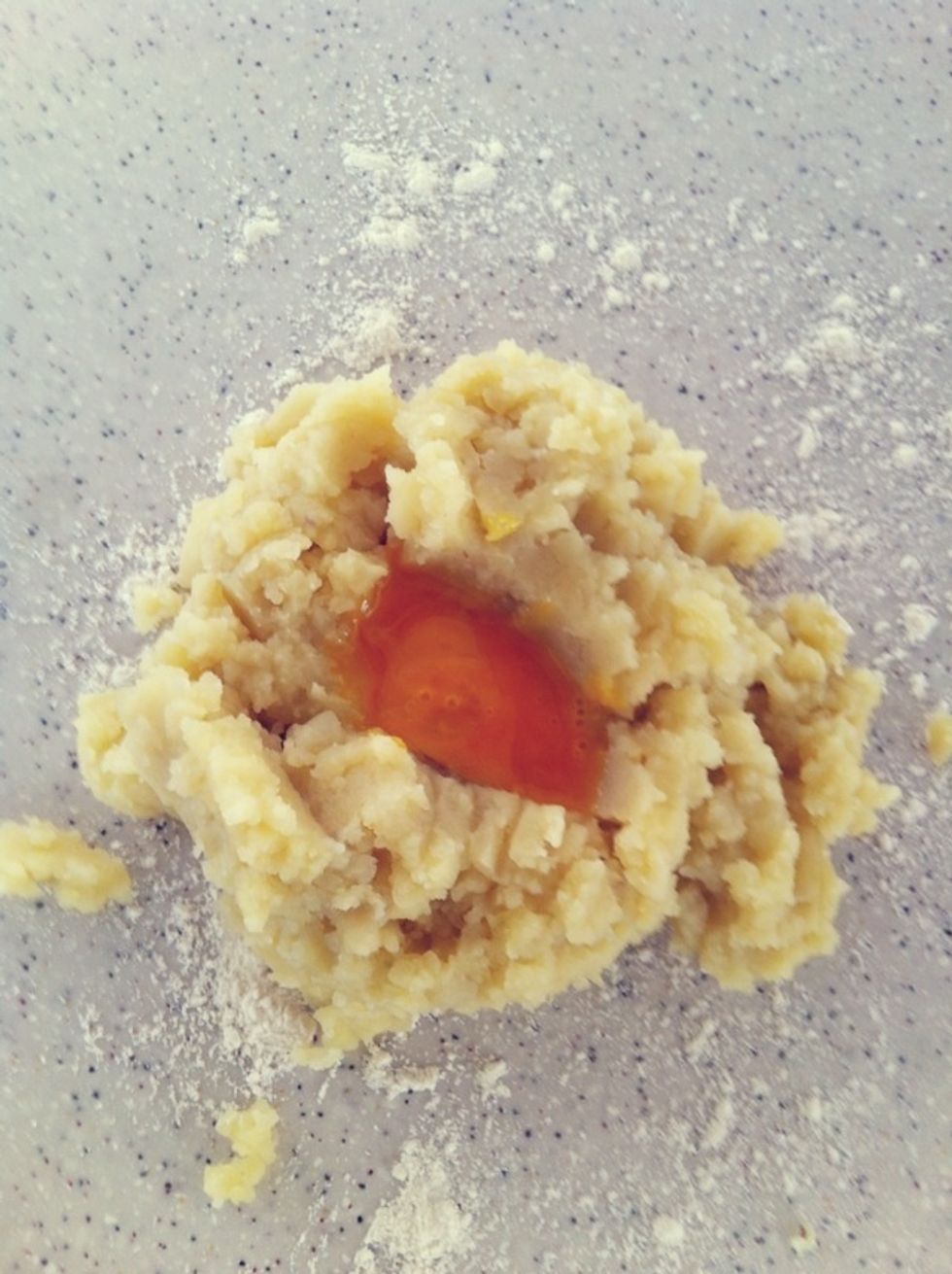 Open up a hole & add in the yolks