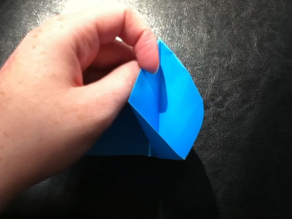 Open up one side for a squash fold.
