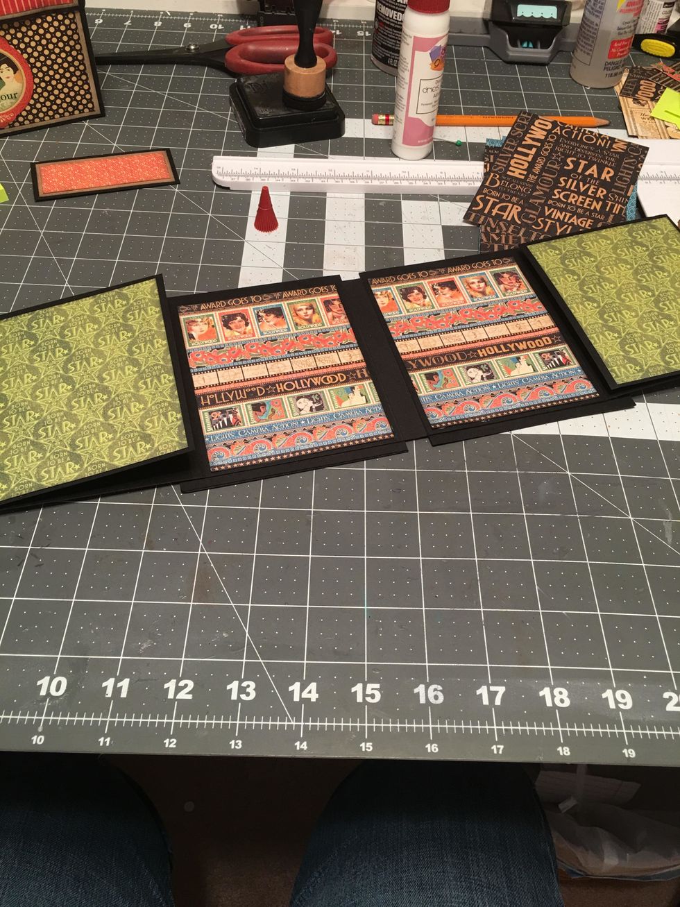 Open up the album again on both sides and cover with patterned paper as shown.