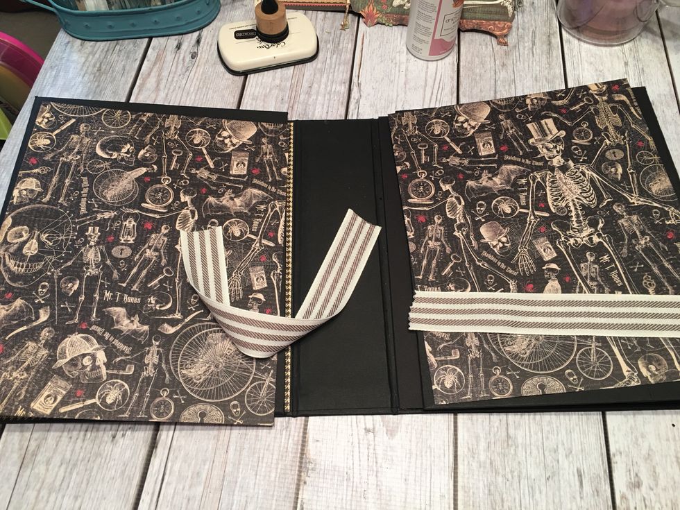 Open up the album and for the first two sections, cut patterned paper 10 1/2" Tall x 8 3/8" wide.  Cut 2 pieces of 1 1/4" wide ribbon in to 2 each 10 1/2" lengths. These are for the belly bands.
