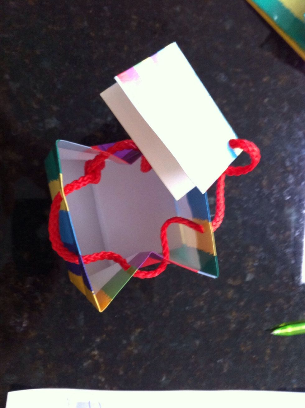 Open up the bag, insert gift and sign the card.