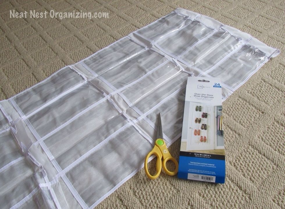 Open up the shoe organizer and lay it out on the floor.