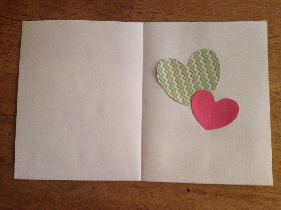 Open up your card, and inside, glue down 2 hearts of the same paper used for the front. They can actually be any shape you want.