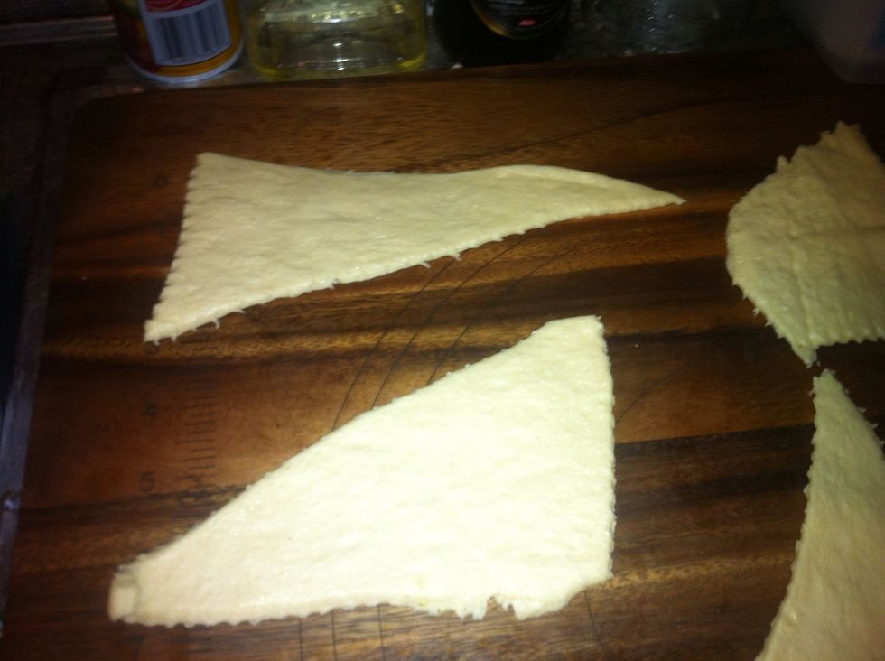 Open your crescent rolls. Spray a surface with nonstick cooking spray, and with a rolling pin, roll out the crescent dough to get a big smooth surface.