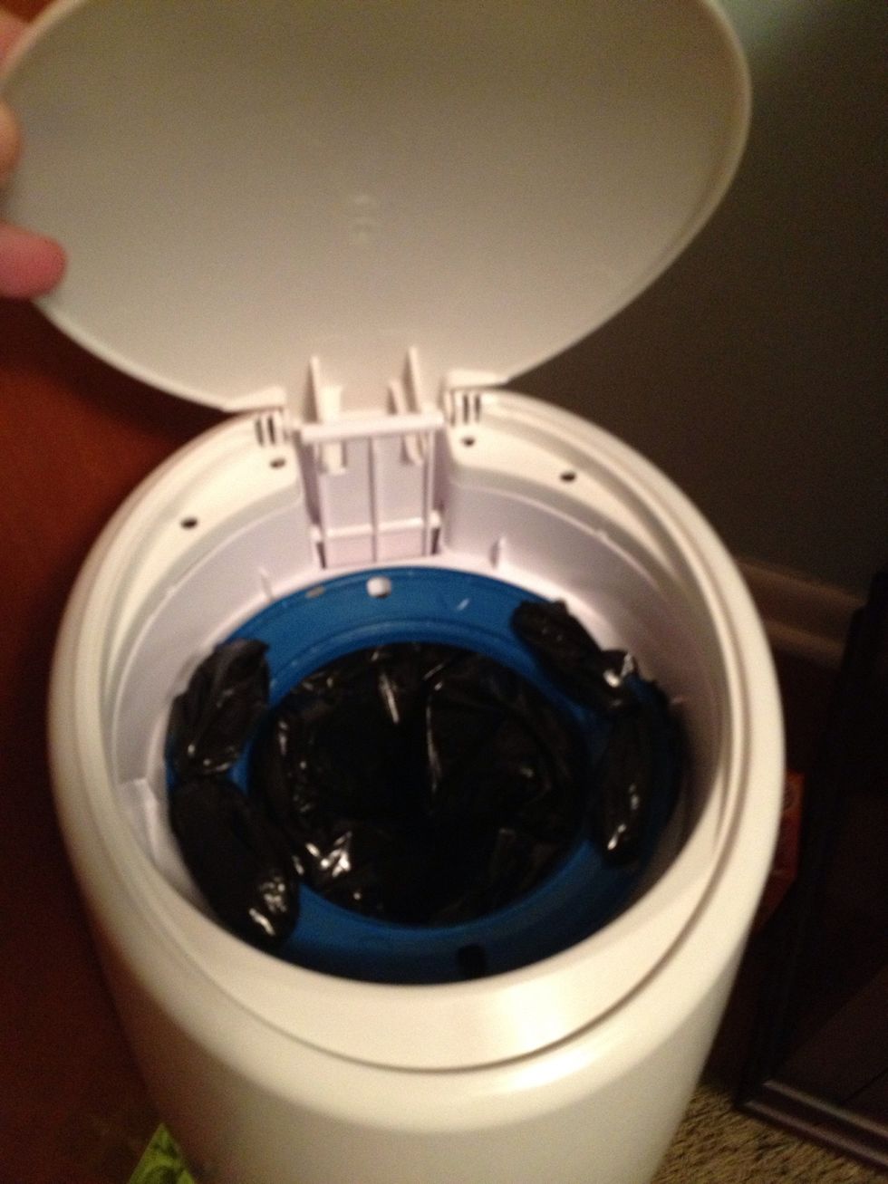Open your diaper pail and thread the bag down through.You may have to pull from the inside to get things even. Pour a little baking soda in to help with odors.1 bag lasts us a week with a one year old