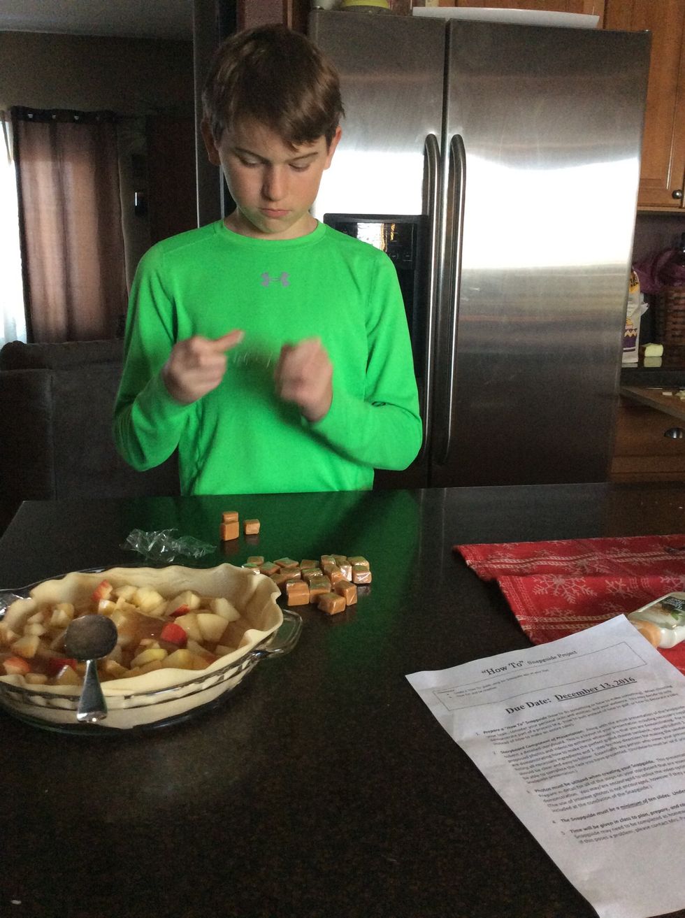 Opening caramels to put on top.