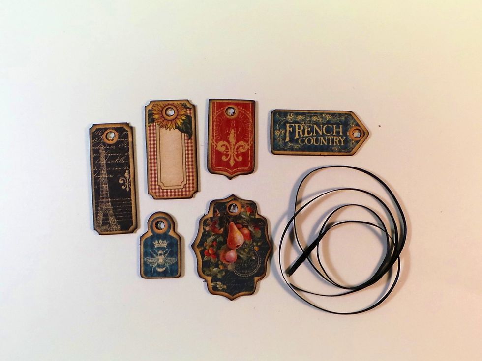 Optional: Create "Charms" to hang from eyelets on either/both Front and Back covers. Use tags from French Country Chipboard 1 and back with scraps of pattern paper.