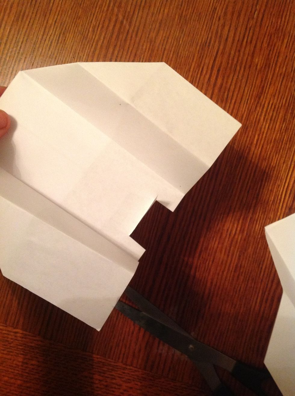 Optional: cut a small flap in the back between the wings. When folded up or down it will make the plane go up or down.