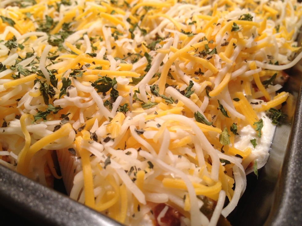 Optional last step is to garnish with parsley flakes/Italian seasonings. Cover with foil and bake for about 30 minutes in order for flavors to blend and to melt the cheese.