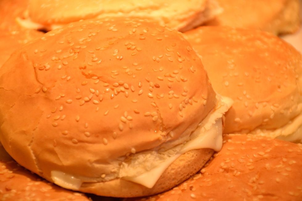 Optional: Lay the top bun and sear in a pan or on the BBQ. Use 1 set of crown ( top part of bun) and heel with the melted Swiss as the top bun The second bun becomes the bottom bun.