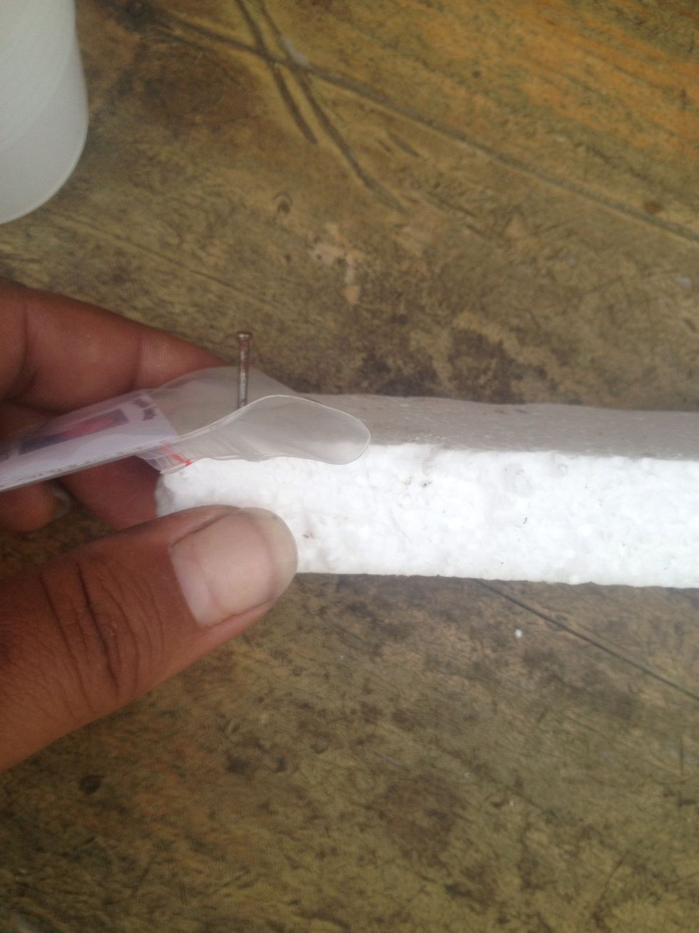 OPTIONAL: Press a nail thru a ziplock bag or a folded seed packet as a marker. You could just write on the top with a permanent marker