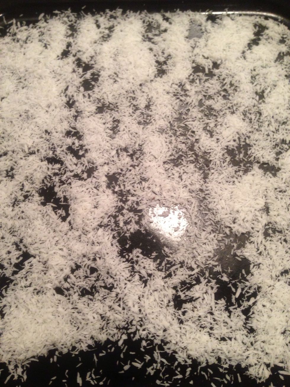 OPTIONAL: Put half of the coconut (1/4 cup) in a shallow baking pan to toast. Spread coconut thin so that it may toast faster and evenly. Toast in the over on 400 degrees.