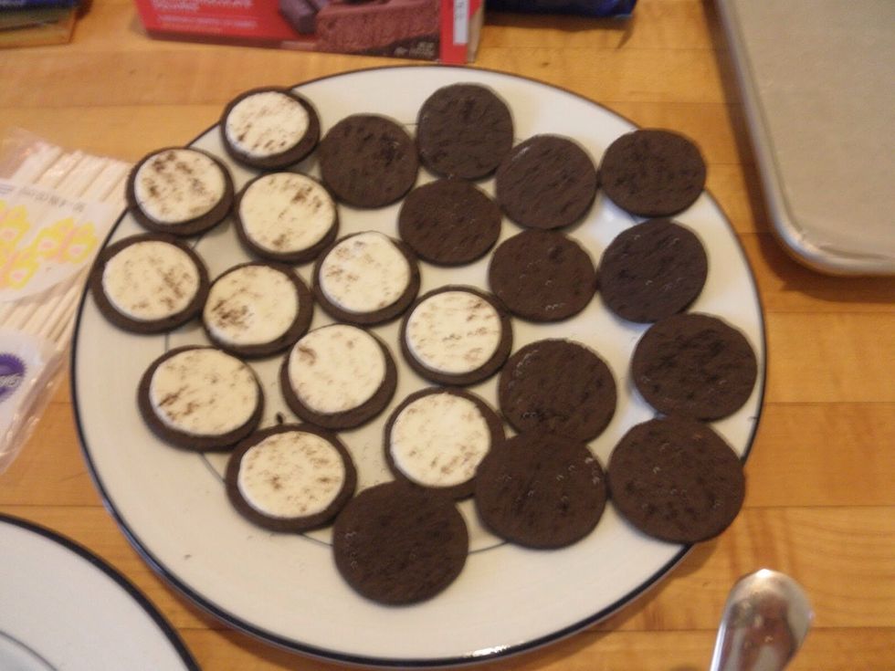 Optional : take the empty Oreo that I told you to put aside and just cut them to half for the owl's ear.  TIP: you have to put the half Oreo UNDER the eyes to make room .