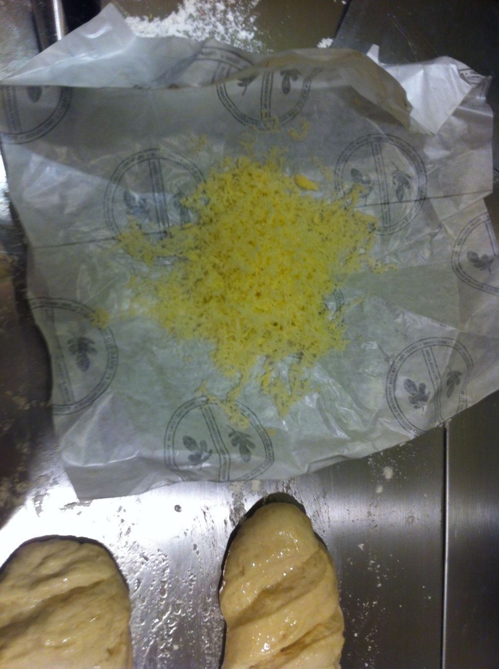 Optional. You can add salt, pepper, or grated cheese to enhance the crust. Let's make one loaf have a cheese crust.