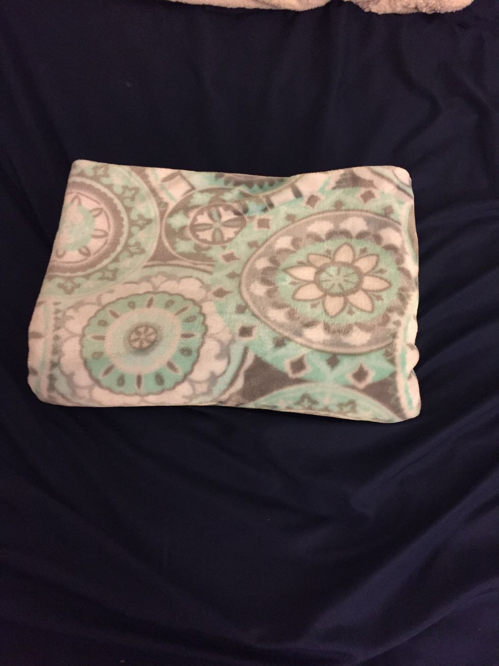 Optional: You can fold it again so the blanket takes up even less space. To do this, fold the blanket the opposite direction then the rest of the tutorial.